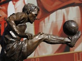 The statue of former Arsenal and Netherlands footballer Dennis Bergkamp after it was unveiled outside The Emirates Stadium in north London on February 22, 2014 