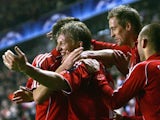 Dirk Kuyt celebrates his goal against Inter Milan with his Liverpool teammates on February 19, 2008.