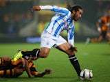 Duane Holmes of Huddersfield Town in action during the Capital One Cup third round match between Hull City and Huddersfield Town at the KC Stadium on September 24, 2013
