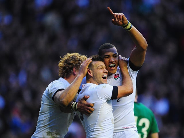 England scrum half Danny Care celebrates after scoring the first England try with Billy Twelvetrees and Luther Burrell during the RBS Six Nations match between England and Ireland at Twickenham Stadium on February 22, 2014