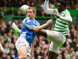 Frazer Wright of St Johnstone competes with Victor Wanyama of Celtic during the Clydesdale Bank Scottish Premier League match between Celtic and St Johnstone at Celtic Park Stadium on May 11, 2013