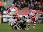 Mike Tindall of Gloucester is tackled during the Aviva Premiership match between Gloucester and Harlequins at the Kingsholm Stadium on February 22, 2014