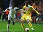 Swansea's Nathan Dyer and Napoli's Gonzalo Higuain in action during their Europa League match on February 20, 2014