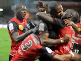 Guingamp's French forward Mustapha Yatabare is congratulated by teammates after scoring during the French L1 football match Guingamp vs Nice on February 22, 2014