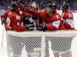 Canada's players celebrating after winning the Men's Ice Hockey Semifinal match between the USA and Canada at the Bolshoy Ice Dome during the Sochi Winter Olympics on February 21, 2014
