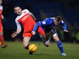 Jimmy Ryan of Chesterfield is tackled by Alan Goodall of Fleetwood Town during the Johnstone's Paint Northern Area Final match at Proact Stadium on February 18, 2014