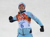 Norway's gold medalist Joergen Graabak celebrates during the Nordic Combined Individual LH on February 18, 2014