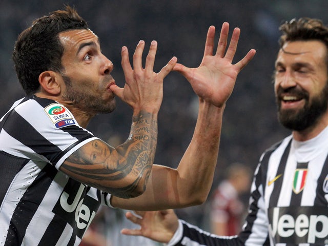 Juventus' Argentine forward Carlos Tevez celebrates after scoring during the Italian Serie A football match between Juventus and Torino on February 23, 2014