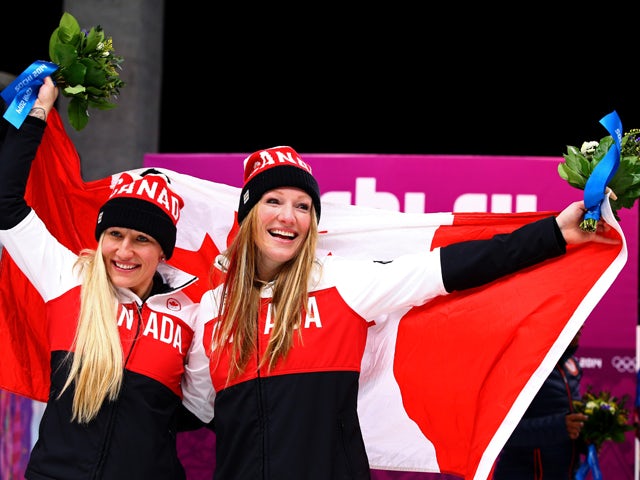 Kaillie Humphries and Heather Moyse of Canada team 1 celebrate after winning the gold medal during the Women's Bobsleigh on Day 12 of the Sochi 2014 Winter Olympics at Sliding Center Sanki on February 19, 2014