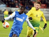 Genk's Kalidou Koulibaly and Anzhi Makhachkala's Fedor Smolov in action during their Europa League match on February 20, 2014