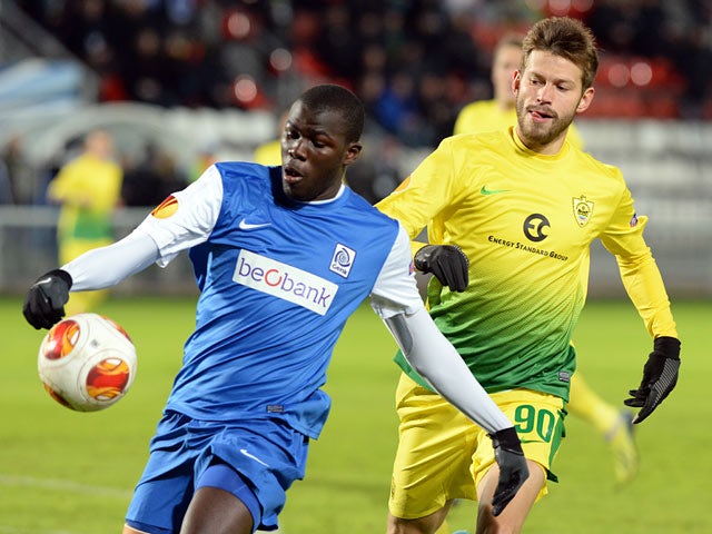 Genk's Kalidou Koulibaly and Anzhi Makhachkala's Fedor Smolov in action during their Europa League match on February 20, 2014