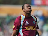 West Indies' Kieron Pollard walks off the pitch after being caught out by Pakistan's Kamran Akmal during the 2013 ICC Champions Trophy cricket match between Pakistan and West Indies at The Oval cricket ground in London on June 7, 2013