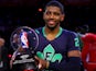 The Eastern Conference's Kyrie Irving #2 of the Cleveland Cavaliers celebrates with the Kia NBA All-Star Game MVP trophy after the 2014 NBA All-Star game at the Smoothie King Center on February 16, 2014