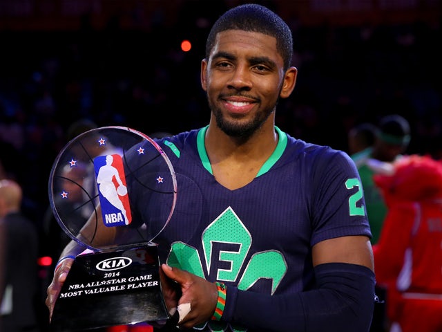 The Eastern Conference's Kyrie Irving #2 of the Cleveland Cavaliers celebrates with the Kia NBA All-Star Game MVP trophy after the 2014 NBA All-Star game at the Smoothie King Center on February 16, 2014
