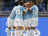 Stefan Radu of SS Lazio celebrates with his team-mates after scoring the opening goal during the Serie A match between SS Lazio and US Sassuolo Calcio at Stadio Olimpico on February 23, 2014