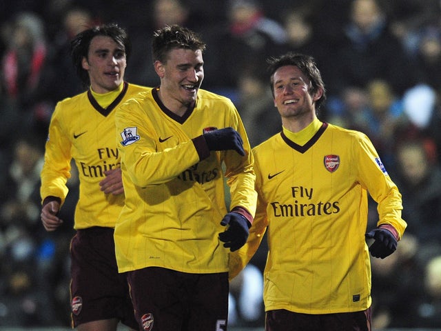 Tomas Rosicky of Arsenal celebrates scoring the opening goal with Nicklas Bendtner during the FA Cup sponsored by E.ON 5th Round match between Leyton Orient and Arsenal at the Matchroom Stadium on February 20, 2011