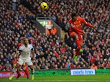 Liverpool's English striker Daniel Sturridge heads to score his team's third goal during the English Premier League football match between Liverpool and Swansea City at Anfield in Liverpool, northwest England on February 23, 2014