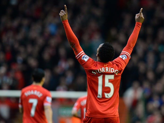Liverpool's English striker Daniel Sturridge celebrates scoring the opening goal during the English Premier League football match between Liverpool and Swansea City at Anfield in Liverpool, northwest England on February 23, 2014