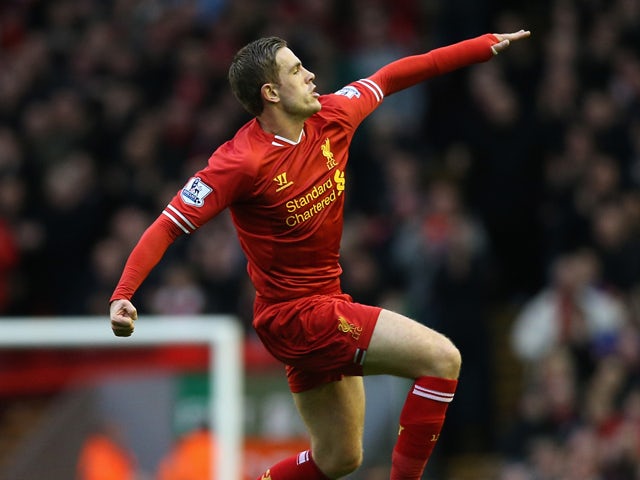 Jordan Henderson of Liverpool celebrates scoring the second goal during the Barclays Premier League match between Liverpool and Swansea City at Anfield on February 23, 2014