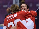 Marie-Philip Poulin #29 and Shannon Szabados #1 of Canada celebrate after Poulin's game winning goal in overtime against the United States during the Ice Hockey Women's Gold Medal Game on day 13 of the Sochi 2014 Winter Olympics at Bolshoy Ice Dome on Feb