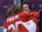 Marie-Philip Poulin #29 and Shannon Szabados #1 of Canada celebrate after Poulin's game winning goal in overtime against the United States during the Ice Hockey Women's Gold Medal Game on day 13 of the Sochi 2014 Winter Olympics at Bolshoy Ice Dome on Feb