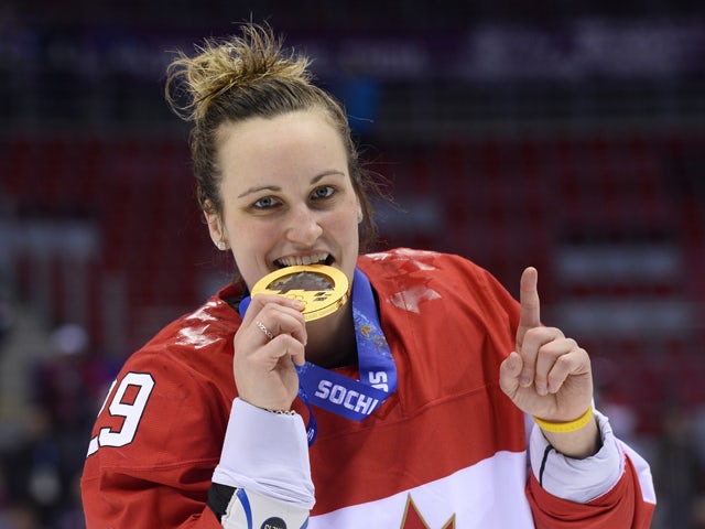 Canada's Marie-Philip Poulin Celebrates With Her Gold Medal During The ...