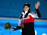 Gold medalist Marielle Thompson of Canada celebrates during the medal ceremony for the Women's Ski Cross on day fourteen of the Sochi 2014 Winter Olympics at Medals Plaza on February 21, 2014