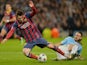 Manchester City's Martin Demichelis fouls Barcelona's Lionel Messi to give a penalty during a UEFA Champions League Last 16 match on February 18, 2014