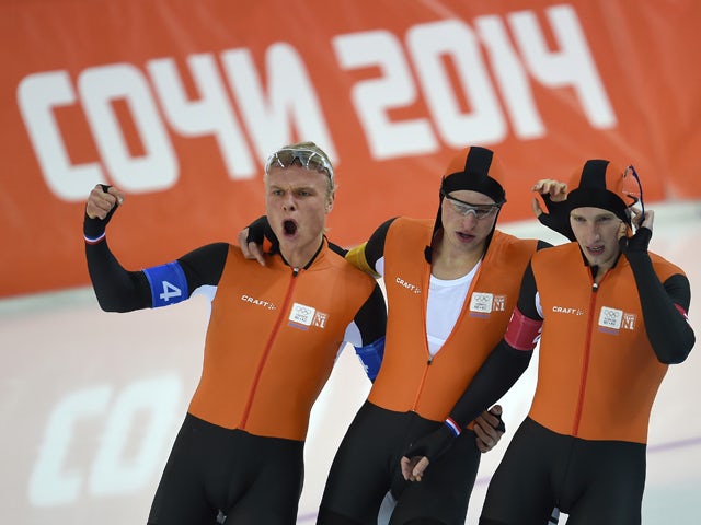 Netherlands' Koen Verweij, Netherlands' Sven Kramer and Netherlands' Jan Blokhuijsen celebrate after winning the Men's Speed Skating Team Pursuit Final at the Adler Arena during the Sochi Winter Olympics on February 22, 2014
