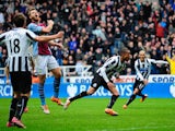 Newcastle player Loic Remy celebrates after scoring the winning goal during the Barclays Premier League match between Newcastle United and Aston Villa at St James' Park on February 23, 2014