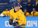 Nicklas Backstrom #19 of Sweden skates against Latvia during the Men's Ice Hockey Preliminary Round Group C game on day eight of the Sochi 2014 Winter Olympics at Shayba Arena on February 15, 2014