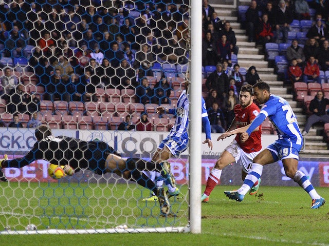 Nicky Maynard of Wigan scores to make it 1-0 during the Sky Bet Championship match between Wigan Athletic and Barnsley at the DW Stadium on February 18, 2014