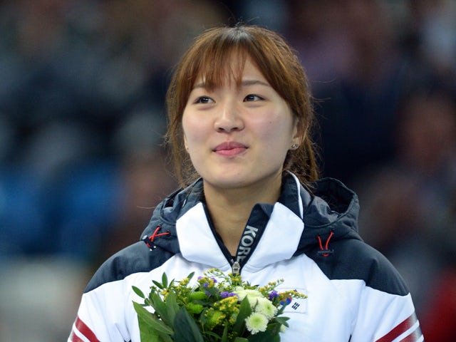 South Korea's gold medalist Park Seung-Hi poses during the Women's Short Track 1000 m Flower Ceremony at the Iceberg Skating Palace during the Sochi Winter Olympics on February 21, 2014