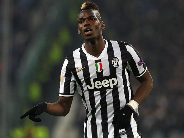Juventus' Paul Pogba celebrates after scoring his team's second goal against Trabzonspor during their Europa League match on February 20, 2014