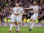 Asier Illarramendi of Real Madrid CF celebrates scoring their opening goal with teammates Daniel Carvajal and Xabi Alonso (R) during the La Liga match between Real Madrid CF and Elche CF at Estadio Santiago Bernabeu on February 22, 2014