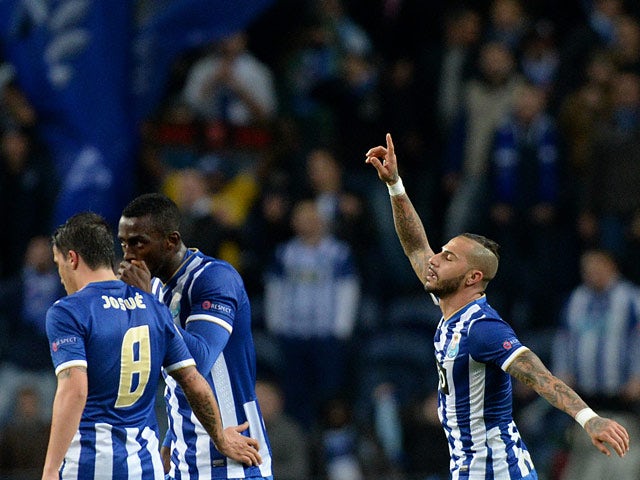 Porto's Ricardo Quaresma celebrates with teammates after scoring against Frankfurt during their Europa League match on February 20, 2014