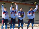 Gold medalists Russia team 1 celebrate on the podium during the medal ceremony for the Four-Man Bobsleigh on Day 16 of the Sochi 2014 Winter Olympics at Sliding Center Sanki on February 23, 2014