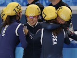 South Korea's Shim Sukhee, Kim Alang, Kong Sangjeong and Park Seunghi celebrate after winning the gold medal in the Women's Short Track 3000 m Relay Final at the Iceberg Skating Palace during the Sochi Winter Olympics on February 18, 2014
