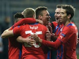 Viktoria Plzen's Stanislav Tecl is congratulated by teammates after scoring against Shakhtar Donetsk during their Europa League match on February 20, 2014