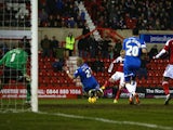 Alex Pritchard of Swindon Town scores the opening goal during the Johnstone's Paint Southern Area Final Second Leg match between Swindon Town and Peterborough United at the County Ground on February 17, 2014