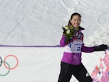 Silver Medallist, Japan's Tomoka Takeuchi celebrates at the Women's Snowboard Parallel Giant Slalom Flower Ceremony at the Rosa Khutor Extreme Park during the Sochi Winter Olympics on February 19, 2014