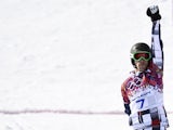 Gold Medallist, Russia's Vic Wild celebrates at the Men's Snowboard Parallel Giant Slalom Final at the Rosa Khutor Extreme Park during the Sochi Winter Olympics on February 19, 2014