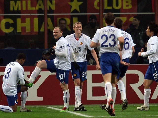 Wayne Rooney celebrates scoring against AC Milan on February 16, 2010.