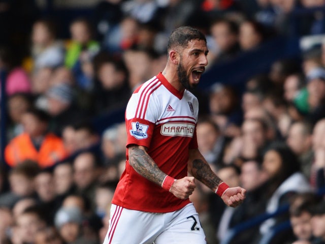 Ashkan Dejagah of Fulham celebrates as he scores their first goal during the Barclays Premier League match between West Bromwich Albion and Fulham at The Hawthorns on February 22, 2014