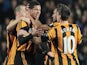 Hull City's English defender Curtis Davies (2nd L) celebrates after scoring his team's first goal against Brighton and Hove Albion during an English FA Cup fifth round replay on February 24, 2014