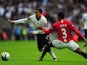 Aaron Lennon takes on Patrice Evra during the League Cup final on March 1, 2009.
