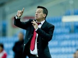 Head coach Allen Bula of Gibraltar gives instructions during the international friendly match between Gibraltar and Slovakia at Estadio do Alagarve on November 19, 2013