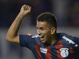 San Lorenzo midfielder Angel Correa celebrates after scoring against Ecuador's Independiente del Valle during their Libertadores Cup Group 2 football match on February 27, 2014