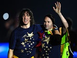 Barcelona's captain Carles Puyol and Barcelona's midfielder Andres Iniesta celebrate at Nou Camp stadium on May 13, 2011