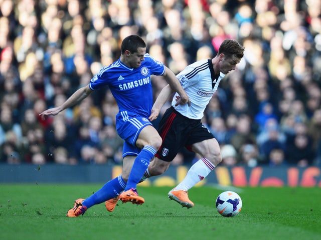 Scott Parker of Fulham holds off Cesar Azpilicueta of Chelsea during the Barclays Premier League match between Fulham and Chelsea at Craven Cottage on March 1, 2014